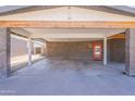 Spacious carport with brick support columns leading to the front door at 1219 E Seldon Ln, Phoenix, AZ 85020