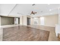 Bright living room featuring tile floors and a ceiling fan at 12451 N Cherry Hills E Dr, Sun City, AZ 85351