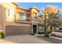 Two-story townhome with balcony and attached garage at 14250 W Wigwam Blvd # 2121, Litchfield Park, AZ 85340