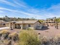 Low-slung single-story home with a large backyard and mountain views at 15212 N Palmetto Ln, Fountain Hills, AZ 85268