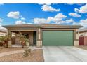 House exterior with green garage door and walkway at 163 W Dragon Tree Ave, Queen Creek, AZ 85140