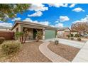 Front view of house showing landscaping and driveway at 163 W Dragon Tree Ave, Queen Creek, AZ 85140