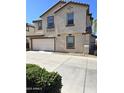 Two-story house with attached garage and landscaping at 16425 W Latham St, Goodyear, AZ 85338