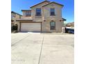 Two-story house with attached garage and driveway at 16425 W Latham St, Goodyear, AZ 85338