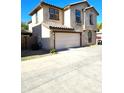 Two-story house with attached garage and driveway at 16425 W Latham St, Goodyear, AZ 85338