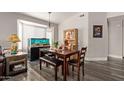 Charming dining area with a wood table, bench seating, and large aquarium at 1823 E Riviera Dr, Chandler, AZ 85249