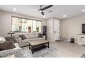 Living room with neutral colored couch and large window at 1852 E Chelsea Ln # 102, Gilbert, AZ 85295