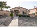 Single-story home with neutral exterior, landscaping, and walkway at 18619 N 136Th Dr, Sun City West, AZ 85375