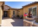 Inviting entry courtyard with seating area at 19334 W Pasadena Ave, Litchfield Park, AZ 85340