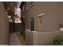 Pathway leads to a side entrance with a gated wall at 2150 W Alameda Rd # 1037, Phoenix, AZ 85085