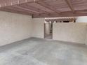 Covered carport with concrete flooring and gated access at 2168 E Sanos Dr, Tempe, AZ 85281