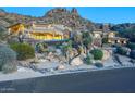 Stunning two-story home with stone accents and mountain views at 26905 N 98Th Way, Scottsdale, AZ 85262