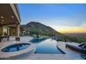 Luxury pool and spa with mountain views and sunset at 26905 N 98Th Way, Scottsdale, AZ 85262