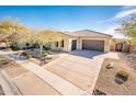 House with a three car garage and a nicely landscaped yard at 32807 N 15Th Gln, Phoenix, AZ 85085