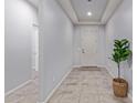 Bright entryway with tile flooring and a view of interior hallway at 35134 N Laredo Dr, San Tan Valley, AZ 85144