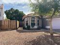 Charming single-story home featuring a desert landscaped front yard and attractive, well-maintained curb appeal at 4043 E Arbor Ave, Mesa, AZ 85206