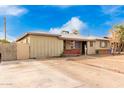 House exterior showcasing a large driveway and front yard at 4405 W Clarendon Ave, Phoenix, AZ 85031