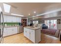 Open kitchen with island and white cabinets at 7930 E Camelback Rd # 509, Scottsdale, AZ 85251