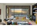 Living room with sliding glass doors that open to a scenic patio and view at 11127 E Mirasol Cir, Scottsdale, AZ 85255