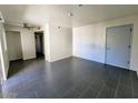 Spacious living room featuring tile floors, ceiling fan and neutral walls at 12221 W Bell Rd # 259, Surprise, AZ 85378