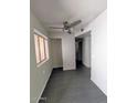 The open living area features tile flooring, neutral walls, and a ceiling fan at 12221 W Bell Rd # 259, Surprise, AZ 85378
