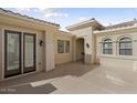 Private courtyard with double doors and access to the home's interior at 13148 W Figueroa Dr, Sun City West, AZ 85375