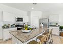 Modern kitchen with stainless steel appliances and granite countertops at 1552 E Mason Dr, Casa Grande, AZ 85122