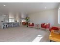 Open concept kitchen with island, white cabinets, and hardwood floors at 1644 W Thunderbird Rd, Phoenix, AZ 85023