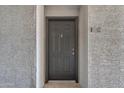 Apartment front door features a gray finish, door knocker, and apartment number at 2025 E Campbell Ave # 140, Phoenix, AZ 85016