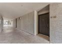 Apartment hallway view of the building featuring textured walls, and building access stairs at 2025 E Campbell Ave # 140, Phoenix, AZ 85016