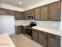 Modern kitchen featuring gray cabinets and white countertops at 25218 W Wayland Dr, Buckeye, AZ 85326