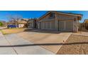 This home has a concrete driveway and three-car garage, offering plenty of parking and storage space at 2715 W Calle Del Norte Dr, Chandler, AZ 85224