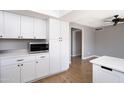 Modern kitchen with white cabinets and stainless steel appliances at 2949 E Willow Ave, Phoenix, AZ 85032