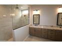 Bathroom featuring granite countertops, and a glass-walled shower at 32464 N 134Th Ln, Peoria, AZ 85383
