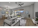 Living room with light gray walls, hardwood floors, and staged furniture at 4275 E Bernice E St, Gilbert, AZ 85295