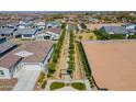 Aerial view of homes and landscaping in new community at 6060 S Antonio --, Mesa, AZ 85212