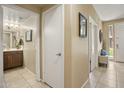 Bright hallway with tile flooring and access to a bathroom and other rooms at 6605 N 93Rd Ave # 1087, Glendale, AZ 85305