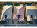 Bird's eye view of a single-Gathering home showcasing its tile roof, solar panels, and well-maintained landscaping at 6616 W Side Canyon Trl, Phoenix, AZ 85083