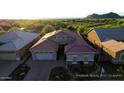 Beautiful single-Gathering home featuring a red tile roof and attached two-car garage in a serene neighborhood setting at 6616 W Side Canyon Trl, Phoenix, AZ 85083