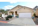 Charming single-story home featuring a two-car garage and low maintenance desert landscaping at 6657 E Regina St, Mesa, AZ 85215