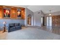 Spacious living room with a built-in display shelf and carpeting at 7833 S Terrace Rd, Tempe, AZ 85284