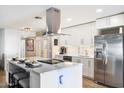 Modern kitchen featuring stainless steel appliances and a large island at 12613 W Brandywine Dr, Sun City West, AZ 85375