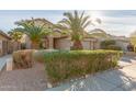 Two-story house with lush landscaping and a two-car garage at 13829 W Rovey Ave, Litchfield Park, AZ 85340