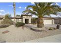 Single-story home with desert landscaping and a two-car garage at 14982 W Gentle Breeze Way, Surprise, AZ 85374