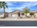 Charming single-story home featuring desert landscaping, a two-car garage, and a well-maintained front yard at 17202 N Javelina Dr, Surprise, AZ 85374