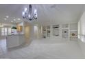 Bright and airy living room featuring recessed shelves and neutral decor at 17733 N Escalante Ln, Surprise, AZ 85374