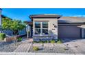 House exterior showcasing front entrance, landscaping, and driveway at 18324 E Spring Valley Ct, Rio Verde, AZ 85263