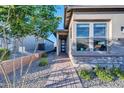 Front entry with walkway, landscaping, and house exterior at 18324 E Spring Valley Ct, Rio Verde, AZ 85263