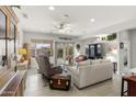 Bright living room with comfortable seating and large windows at 19043 N Aztec Point Dr, Surprise, AZ 85387