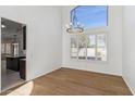 Dining room with hardwood floors and a large window at 2380 W Megan St, Chandler, AZ 85224
